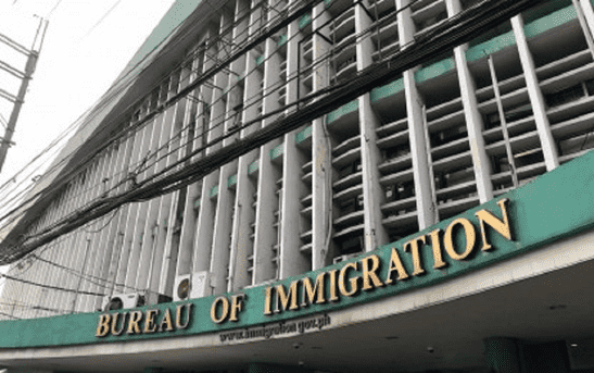 BI_optimized_2 Facade of the Bureau of Immigration building, featuring large windows.