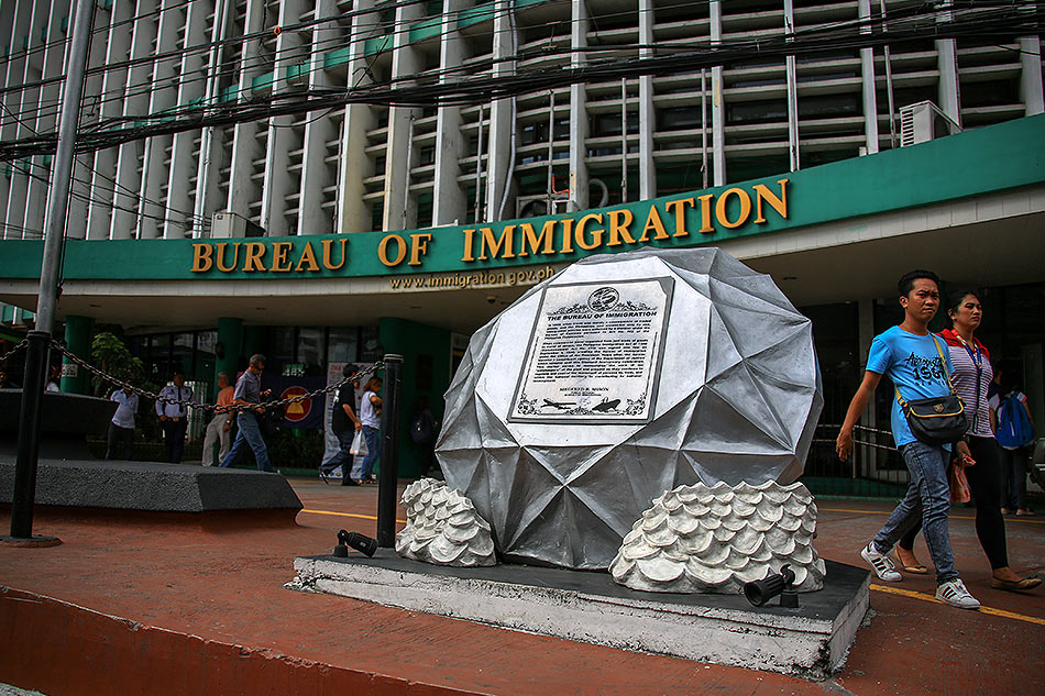 BI_optimized_2 Facade of the Bureau of Immigration building, featuring large windows.